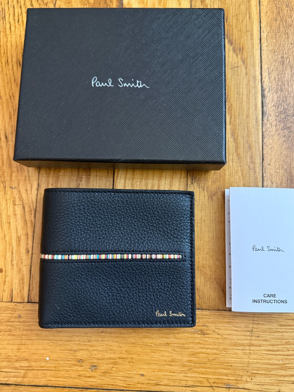 Paul Smith 
Black Signature Stripe Bifold Wallet